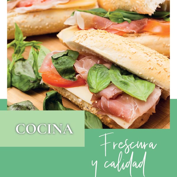 Two fresh Argentinian sandwiches with ham, cheese, tomato, and basil on a wooden board.